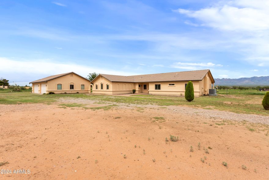 The seller is open to offering a carpet allowance if the appropriate conditions are met. This exquisite property, set on 4 sprawling acres, is a true horse lover's paradise. Boasting recent updates and breathtaking mountain views, this home offers the perfect blend of modern comfort and rural charm. The kitchen and partial flooring were updated in 2024, alongside a partial bathroom update the same year, and partial plumbing updates in 2023. Enjoy the expansive wrap-around patio, perfect for entertaining or relaxing. The large detached 4-car garage provides ample space for vehicles, with additional storage for tools and equipment. This home is a perfect blend of style, functionality, and outdoor living. Don't miss the chance to own this turnkey gem!