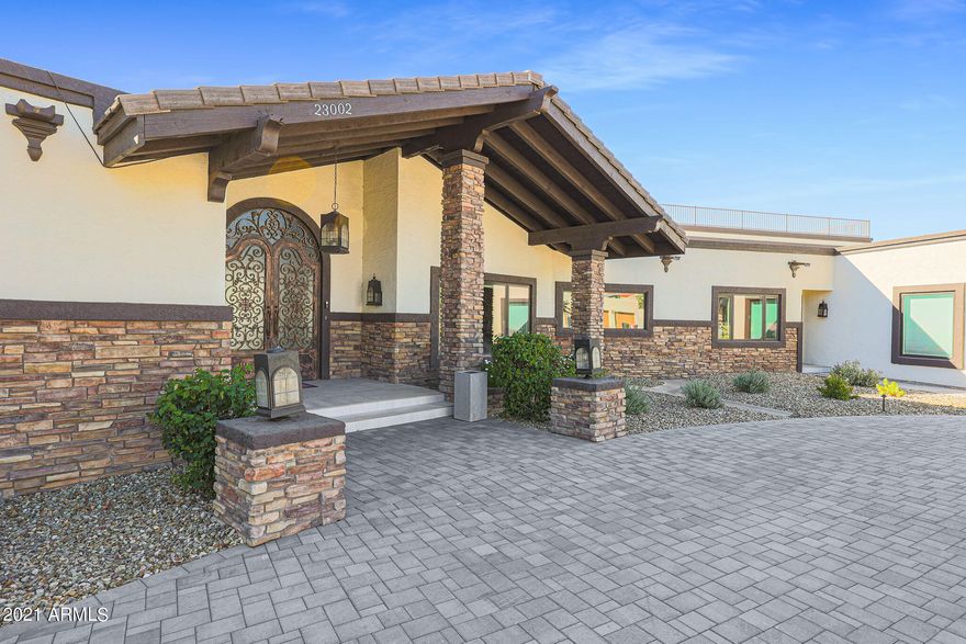 This 6 bedroom 6 bathroom fully remodeled home is a sprawling 8443 square feet. It sits on a 32300 square foot lot in the gorgeous neighborhood of Pinnacle Peak Shadows with views from nearly each window of the home. The home boasts a large gourmet kitchen, guest casita with kitchen and it's own attached garage. The property has enclosed RV parking as well! The finished basement is an added bonus with wine tasting room, movie theater, and kitchenette. The backyard is an entertainer's dream with an outdoor kitchen, pool, sport courts, fruit trees, 2 covered patios and fire pit. Don't miss the expansive unobstructed views from the roof top deck!