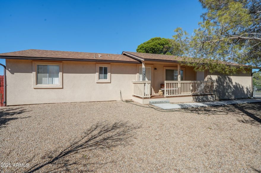 Motivated Sellers: Price reduced and sellers are offering a buyers credit of $5,000. This is a very well loved house inside and out. This house offers a fully fenced front and back yard with tons of storage, rv hookups, kids playhouse and playground, mature trees and landscaped. Conveniently located with being out of the hustle and bustle of the big city, but just a 45 minute drive to the valley or 30 minutes into Prescott Valley. Great Size lot with options.
