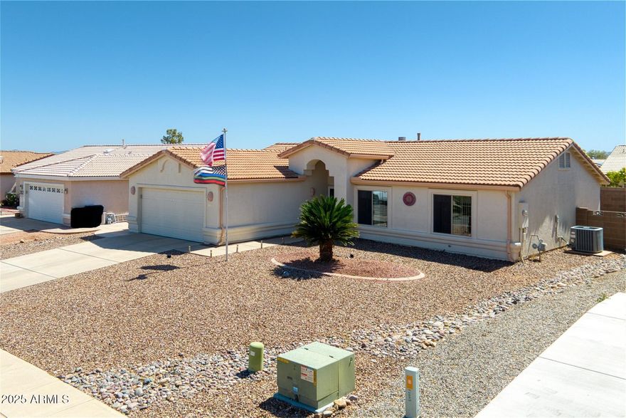 Gorgeous open upgraded 3-bedroom, 2-bath home featuring a screened-in Arizona room perfect for year-round enjoyment. The kitchen shines with granite countertops, glass tile backsplash, upgraded appliances, and a spacious layout ideal for entertaining. Luxury vinyl flooring, complemented by a cozy gas fireplace in the living area. Enjoy stunning views of the Huachuca Mountains from the beautifully landscaped backyard, complete with irrigation for easy maintenance. This home combines comfort, style, and breathtaking scenery—don't miss your chance to make it yours!