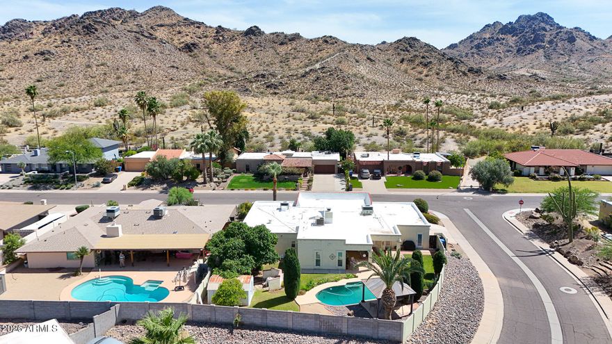 Fabulous location Next to PHX Mountain Preserve. City Light Views to the North and Mountain Views to the South. Very desireable private neighborhood location. Hiking and biking trails across the street. upgraded with 2 Master Suites, 3 more bedrooms and 2 seperate offices or dens. Gourmet Kitchen with Double Ovens and  Granite slab countertops and R/) water filtration system. 3 Trane HVAC units. 2 Hot Water Heaters.. Remodelers dream house.