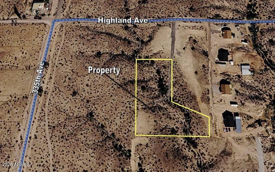 Beautiful panoramic view of the white tank mountains. Shared well with servicing four lots. Very few neighbors. Great location for a custom home. Located near I-10 and the masterplan community Belmont. Underground power on property line (Highland Ave). Property tax shown is for 5 acre parcel before minor land division. No HOA and plenty of room for Horses, Toys & RV parking.