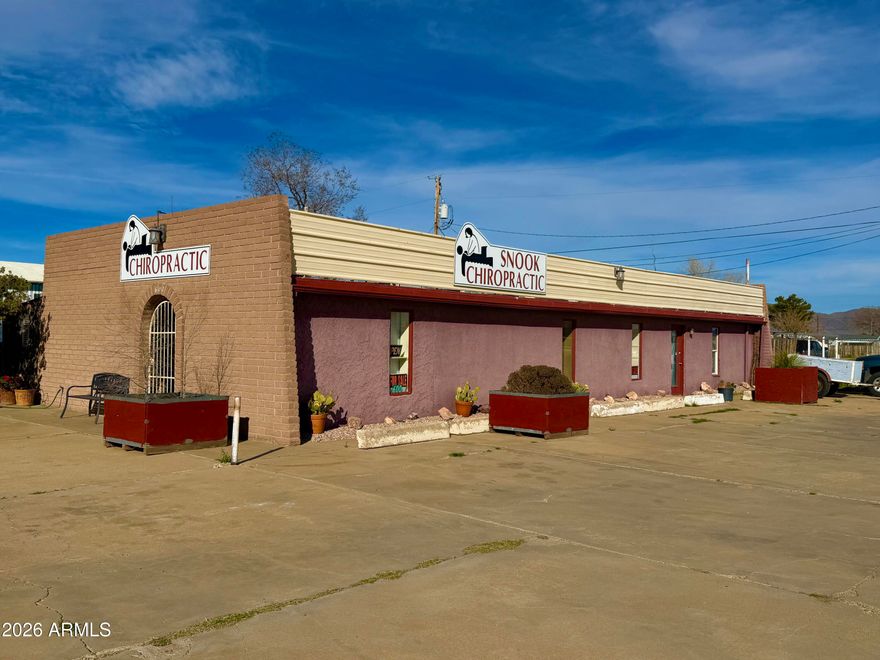 INCREDIBLE LOCATION! High-traffic, high-visibility commercial corner lot in a prime Uptown corridor on Rex Allen Dr, just three blocks from the hospital and surrounding medical facilities. This well-maintained building is currently operating as a chiropractic office and offers excellent flexibility for a variety of professional uses. 
The property features a minimum of 10 on-site parking spaces, providing convenience for clients and staff. Its strong street presence and corner positioning offer outstanding exposure and signage opportunities. Ideal for continued chiropractic use or conversion to medical office, dental practice, beauty salon, or other professional office space. A full kitchen and private relaxation room make the space more versatile for medical, wellness,or professional use , easy access to Interstate 10 and located near popular shopping and dining, strategic location for long-term growth. Don't miss this opportunity to own a well-maintained commercial building in a prime, high-demand area.
