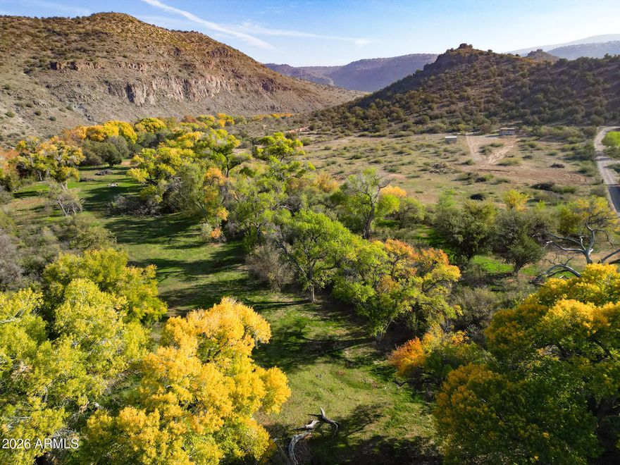 RARE OPPORTUNITY TO OWN A LEGACY PROPERTY. 32 Acres, comprising 4 separate parcels. With OAK CREEK FRONTAGE. Well, newly installed septic/leach field, storage & small quarters. PRIVACY, QUIETUDE, RETREAT! Grandfathered irrigation rights from Oak Creek via ditch. 3 ponds, one currently active. CC&R's, Suitable for vineyard, riparian bird sanctuary, family get-a-way. Backing partially to Forest Service land on North side. Page Springs Rd is the heart of Verde Valley wine country. Electric on property.