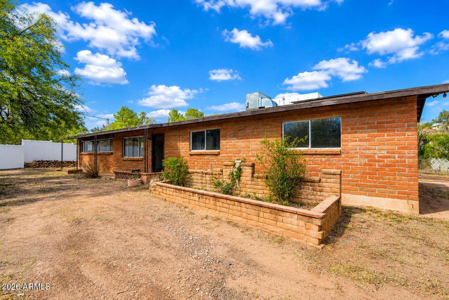 Welcome to this charming 3-bed, 2-bath home situated on a generous 0.62-acre lot in the desirable Royal Road Terraces neighborhood. Built in 1964, this property has been previously updated to the kitchen, bathroom fixtures, and systems. The home features solar panels for energy efficiency and long-term utility savings. A spacious family room provides ample gathering space, while a versatile bonus area offers flexibility for home office, recreation, or creative projects. The expansive lot provides privacy, room to breathe, and potential for future enhancements. Located minutes from State Route 82 for convenient regional access, and just a short drive to vibrant Downtown Nogales with its shops, dining, and community services. This property combines accessible location with country-feel living. An excellent opportunity for buyers seeking value, established infrastructure, and room to make this home their own.