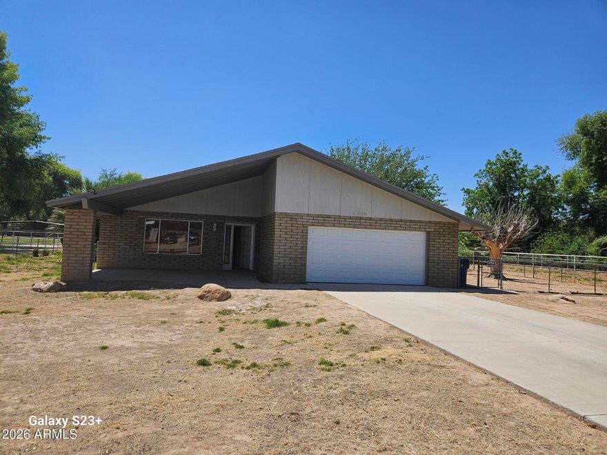 Beautiful property featuring fenced pastures, horse corrals--perfect for equestrian living. The home offers a comfortable layout, cabinetry, ample storage, three bedrooms plus a den, NO HOA.

The family room showcases a wood accent wall and a cozy fireplace, creating a warm and inviting space. as well as nice tile floor in the main areas, and the den/office provides a generous, versatile area with designer touches & elegant laminate wood flooring