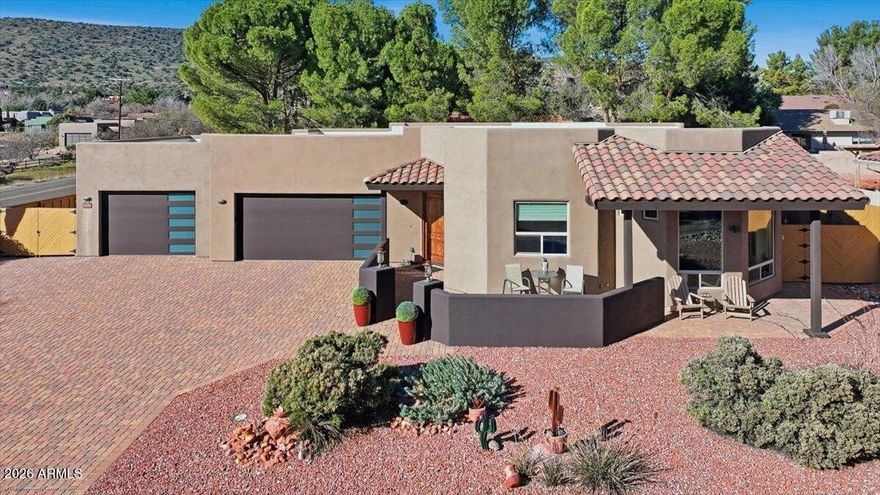 This peaceful setting, offers timeless construction, a functional layout, and a seamless connection to its surroundings. This 3 BR, 3 BA home sits just moments away from the Oak Creek Country Club.  It boosts a high-end kitchen and bathrooms with Alder cabinetry and granite countertops. Spacious great room with fireplace. Generously sized bedrooms and an oversized 3-car garage.Designed for comfort and livability, the home features well-proportioned living spaces, abundant natural light, and enduring finishes that reflect pride of ownership. Whether used as a primary residence or a second home, this property provides a rare opportunity to own a relatively newer custom build in one of Sedona's most desirable locations. Conveniently located to hiking trails, red rock views, golf and dining.