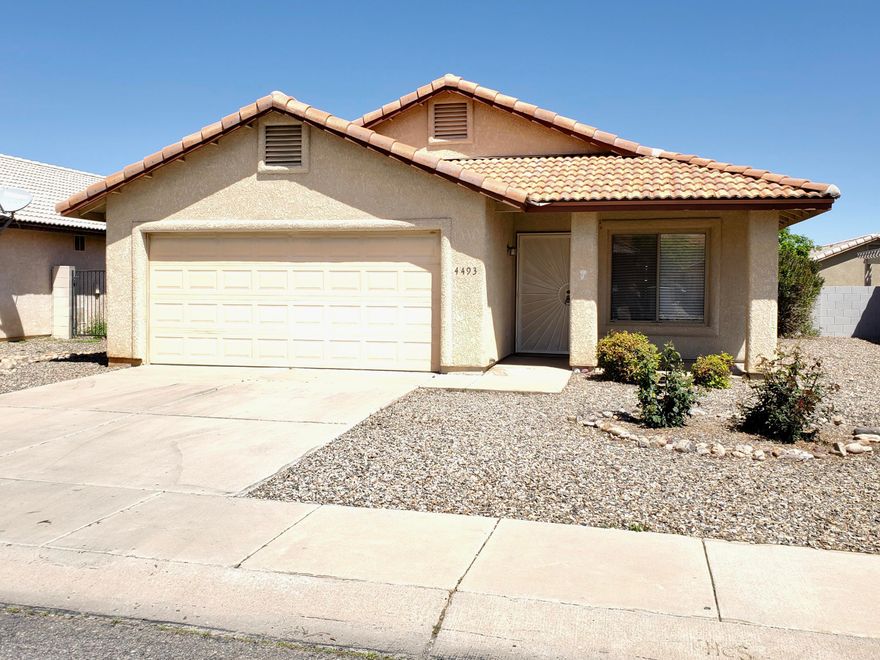 Ready to be your home or an awesome investment property!  Lots of light throughout this 3 bedroom, 2 bathroom home.  The house has been professionally cleaned, including the carpets.  Fresh paint in the kitchen, all interior doors, guest bedrooms, and both bathrooms.  Open floor plan with ceramic tile and laminate.  Carpet only in bedrooms.   Storage and space for those necessary things in life: pantry closet, two hall closets, laundry room, and two car garage.   This is a well kept home, ready to move in!