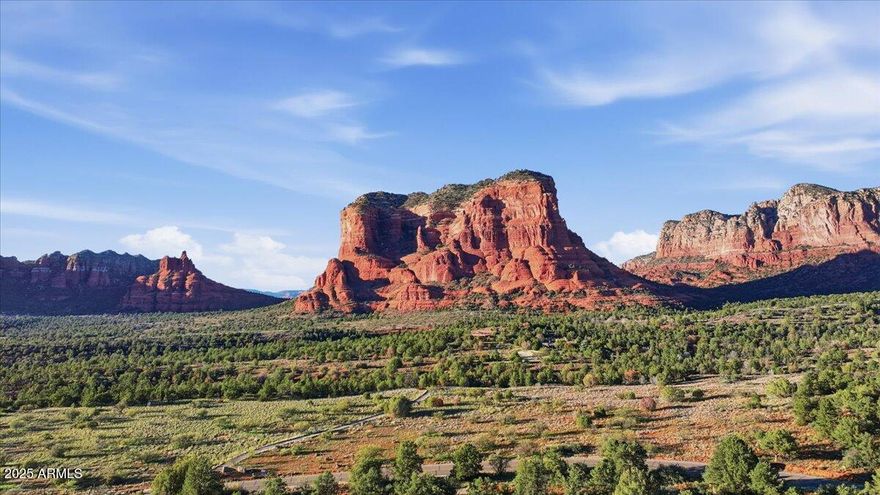 Extraordinary Opportunity!  Stunning 2.7-acre property with sweeping, unobstructed Red Rock views in beautiful Sedona. This premium custom homesite is ready for you to create your dream residence, with breathtaking vistas of Castle Rock, Bell Rock, Courthouse Butte, and Lee Mountain. The level building area makes construction easy, while the expansive lot offers privacy and tranquility. Imagine enjoying unforgettable Sedona sunsets from your future patio, deck, or pool. Located just minutes from National Forest trails for hiking and recreation, yet only a quick 5-minute drive to shopping, dining, and services. A rare opportunity with no HOA, offering both luxury and freedom. You must see this lot to appreciate all it has to offer. One of the Sellers is a AZ Licensed Realtor. Buyer to participate in a 1031 tax exchange for the seller at no cost to buyer.