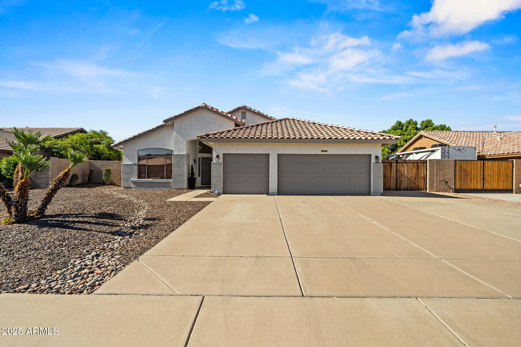 6935 W MONTE LINDO Street