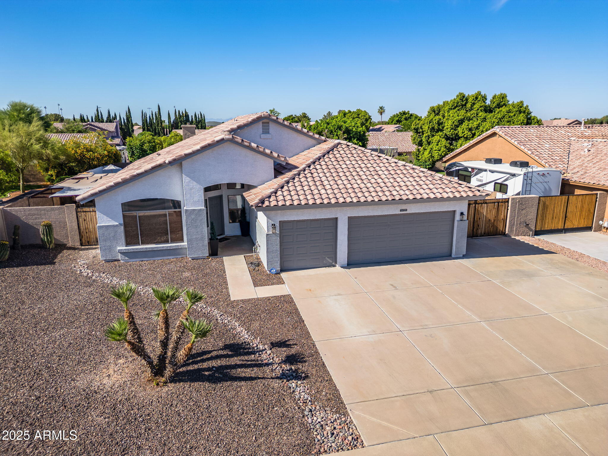 6935 W MONTE LINDO Street