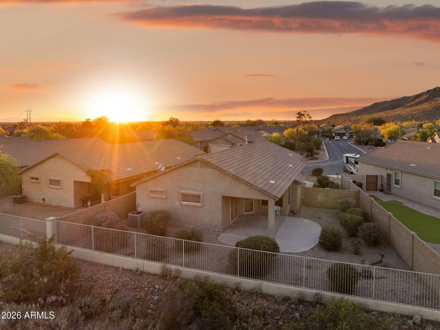 Beautifully updated home nestled near the base of the Superstition Mountains in one of Gold Canyon's most sought-after communities. The thoughtfully designed open kitchen features granite countertops, a large kitchen island, and a buffet/coffee bar, making it perfect for both everyday living and entertaining. A spacious eat-in dining area provides a comfortable setting for casual meals and offers abundant cabinetry for exceptional storage. The expansive primary suite offers a peaceful retreat, complete with a generous walk-in closet. In the family room, soaring vaulted ceilings and a cozy fireplace create a warm, inviting ambiance--ideal for relaxing or gathering with guests. Step outside to your private backyard oasis, where a large covered patio frames views of the Superstition Mountains all while backed to a serene desert preserve--perfect for enjoying Arizona's beautiful sunsets. With low HOA fees, residents enjoy access to outstanding amenities, including a heated community pool and spa, scenic walking and hiking trails, and proximity to multiple golf courses. Plus, boating, kayaking, and fishing opportunities are all within a convenient drive. Welcome Home to your Arizona Retreat in picturesque Gold Canyon at the Foothills of the Superstition Mountains!