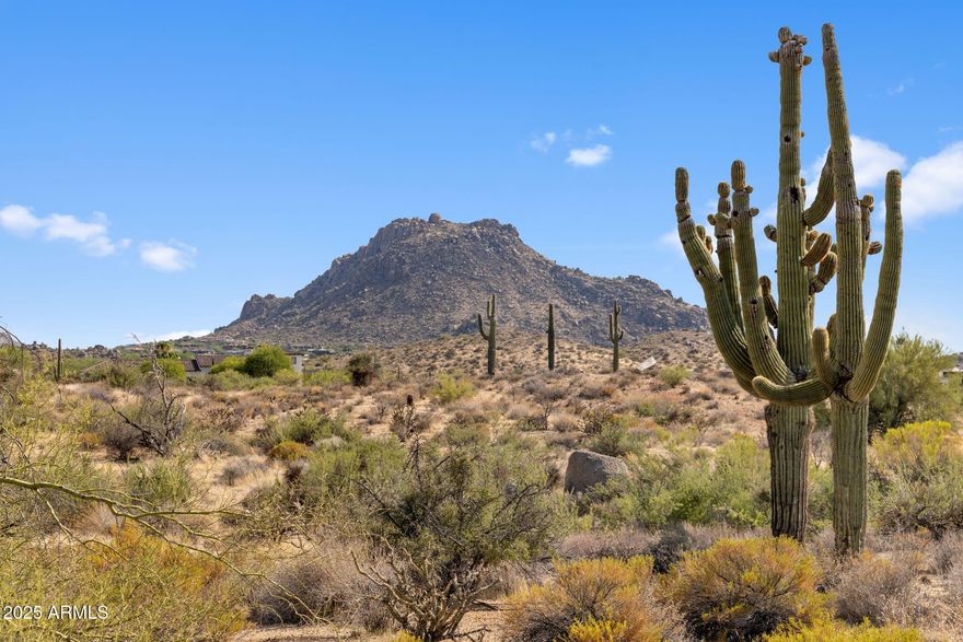 Nestled within one of North Scottsdale's most prestigious areas, this exceptional 5-acre parcel presents a rare chance to create an unrivaled desert estate. Surrounded by multi-million-dollar residences and set against a backdrop of sweeping mountain vistas, twinkling city lights, and the serene Sonoran desert, the property offers both privacy and prestige in equal measure.  With ample space to design a custom residence, guest casita, resort-style pool, or even a private car gallery, the possibilities are endless. The gently contoured terrain provides a natural canvas for dramatic architecture while capturing iconic views of Pinnacle Peak, Troon Mountain, and vibrant Arizona sunsets. Mature desert flora, including stately saguaros and desert wildflowers, enhances the sense of place and All material information must be verified during the inspection period