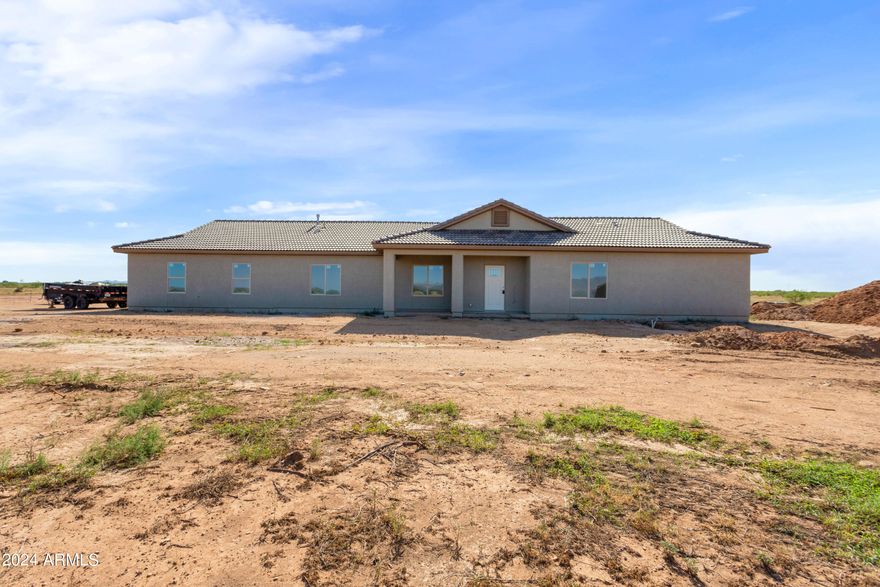 SELLER INCENTIVE of $20,000 TO BUYERS AS SELLER CONCESSIONS TO BE USED AT BUYERS DISCRETION. Brand new construction located in the gorgeous newer subdivision of Rancho Arizona with unobstructed mountain views to the east and the west. 
Enjoy calling this property home with its 4 bedrooms, 1 office/den, and 3 bathrooms. Enjoy your time at home or entertaining with a spacious great room, dining area, and amazing kitchen complete with wall oven, gas cook range, island and granite counters. This home is situated on a corner lot with south entrance and north back patio exposure that allows for all day enjoyment. Home comes with an electric tankless water heater and tile floors throughout. 
Be the first to call this one HOME!