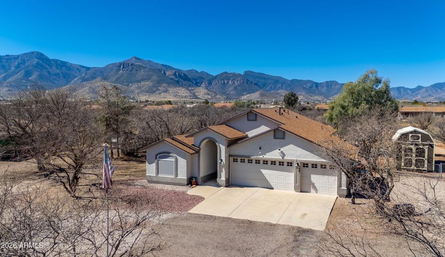 Situated on more than 1 acre of horse property on a peaceful cul-de-sac, this extensively updated home showcases stunning mountain views, outstanding seclusion, and an incredible opportunity to experience the best of Hereford/Sierra Vista living. Ideally located just minutes from Ft. Huachuca, the property is also close to some of the area's renowned birdwatching destinations, creating the perfect setting for outdoor recreation and nature enthusiasts. An additional advantage is the sought-after VA assumable loan available to qualified buyers and the potential of paid closing cost with accepted offer. Carefully improved and truly turnkey, the home includes a new roof (Jan 2025), fresh interior and exterior paint (March 2025), and an expansive Arizona room completed in Fall 2024 featuring its own dedicated mini split for all-season comfort. Inside, dramatic vaulted ceilings and a well-designed split floor plan provide a bright, welcoming feel, accented by stylish granite countertops throughout.
The generous primary suite offers a relaxing escape with a dual-sink vanity, oversized soaking tub, separate shower, and a large walk-in closet. Outdoors, the easy-care backyard is ideal for both unwinding and entertaining, complete with artificial turf, a serene new fishpond, and gated access to the rear acreage--perfect for horses, RV parking, trailers, or future possibilities.
Additional features include a 3-car garage, a large wooden storage shed with dual-gate access, and a full Arlo security system. Blending contemporary upgrades, horse property versatility, scenic surroundings, and convenient access to Ft. Huachuca, this property offers an exceptional lifestyle opportunity.