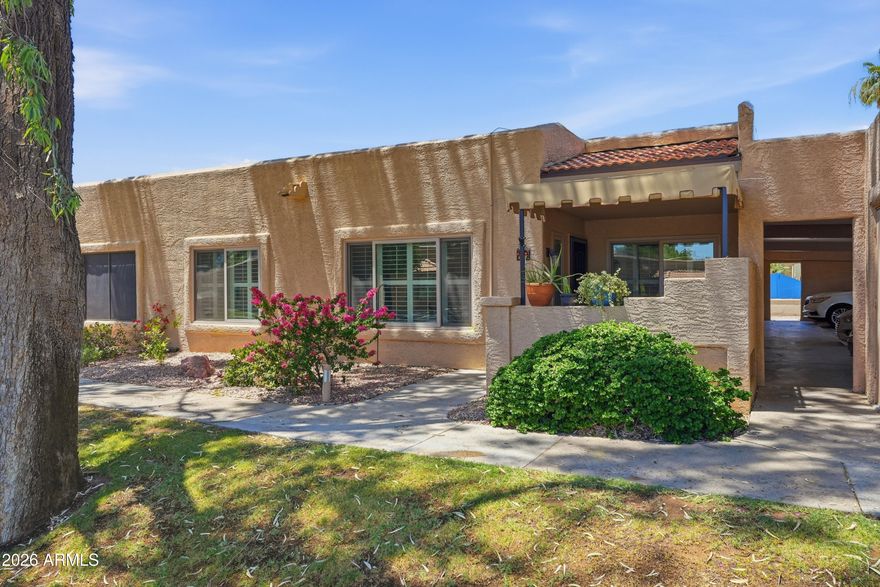 Beautifully updated condominium within the much desirable Sun Village Resort in the heart of Surprise, AZ!  This 2-bedroom, 2-bathroom, end unit condominium offers approximately 908 square feet of living space. Features include updated kitchen with granite countertops, a stainless farmers sink, and slide-outs in the cabinets for added storage. The laundry room is accessed through a classic barn door adding elegance to your kitchen. The bathrooms have been updated including showers, countertops, & commodes. Additional upgrades include the air conditioning system in 2024, a new water heater in 2023 and custom paint throughout. The home also has updated hardware, ceiling fans, and plantation shutters. Outdoors, there is a new patio cover and tile plank flooring. Don't miss this opportunity!