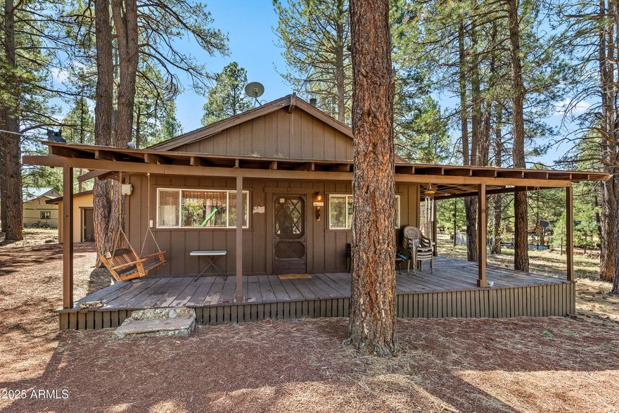 Sherwood Forest cabin in the woods.
This quintessential cabin is 2 bedrooms on an acre.
Enjoy the cool pines of Williams.  There are 2 bedrooms on main floor and there is an upstairs loft that can
also be used as a bedroom, office of playroom.
2 car detached garage.  Home needs some TLC and
updating but has tremendous potential.