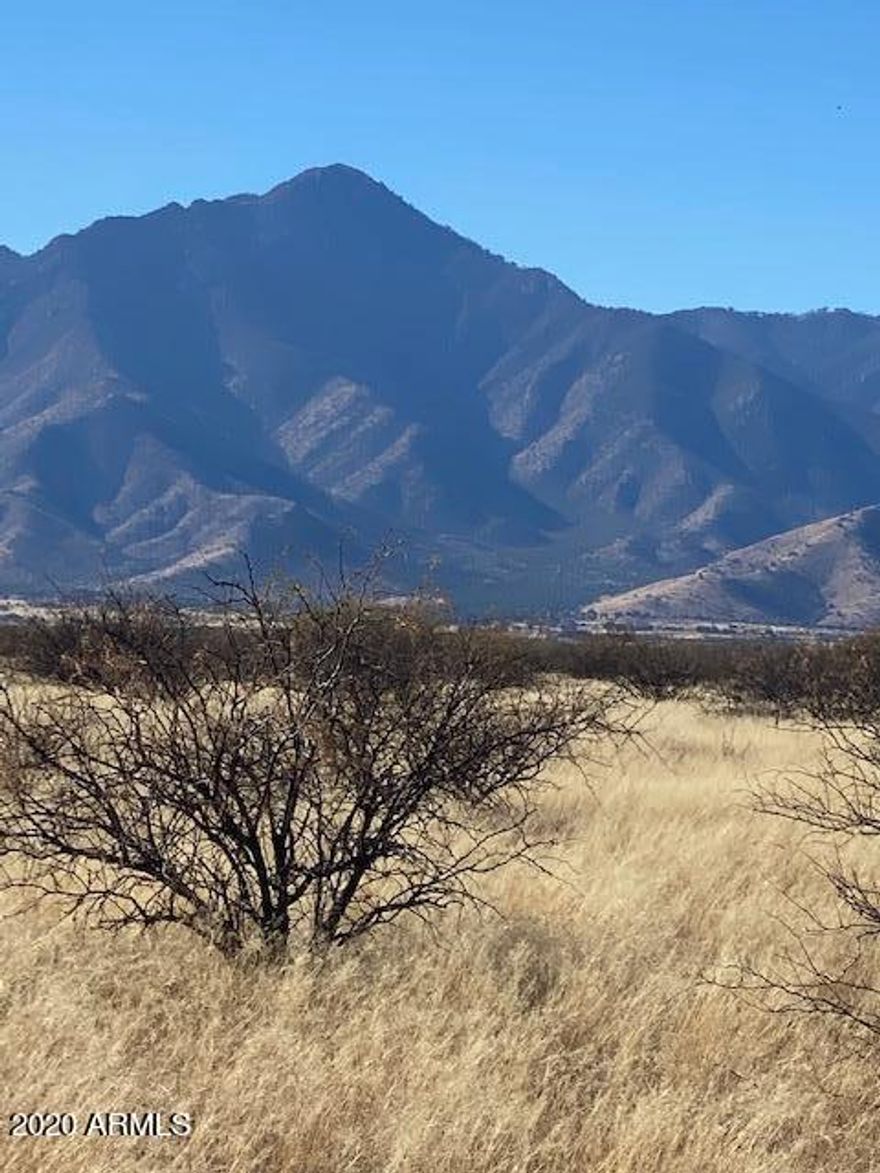 8 Acre Stunning mountain view Custom built home site 3 water share ,600 ft. easement  off Calle Mia Road. Runs through middle of property. Follow directional sign on Calle Mia to sign on property. Well needed