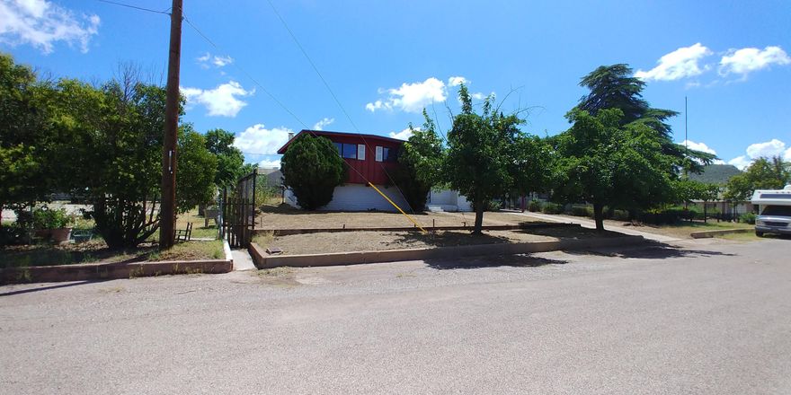 Here is a great opportunity to purchase a home just off the Vista and across from Greenway School. This split entry home has the mster suite taking up the entire lower level.  There is a big walk in closet as well as under stairs storage in the basement level. On the main level, there is a good sized living room with a gas fireplace, good sized kitchen and nook as well as a family room and bath. Upstairs there are 3 bedrooms. Out back, there is an old pump house building (pump is gone) that is really cool and also a small shed. There is a fenced yard as well. This is an AS IS sale. The seller will NOT be making any repairs and the price reflects the condition of the home. This will not last at this great price!