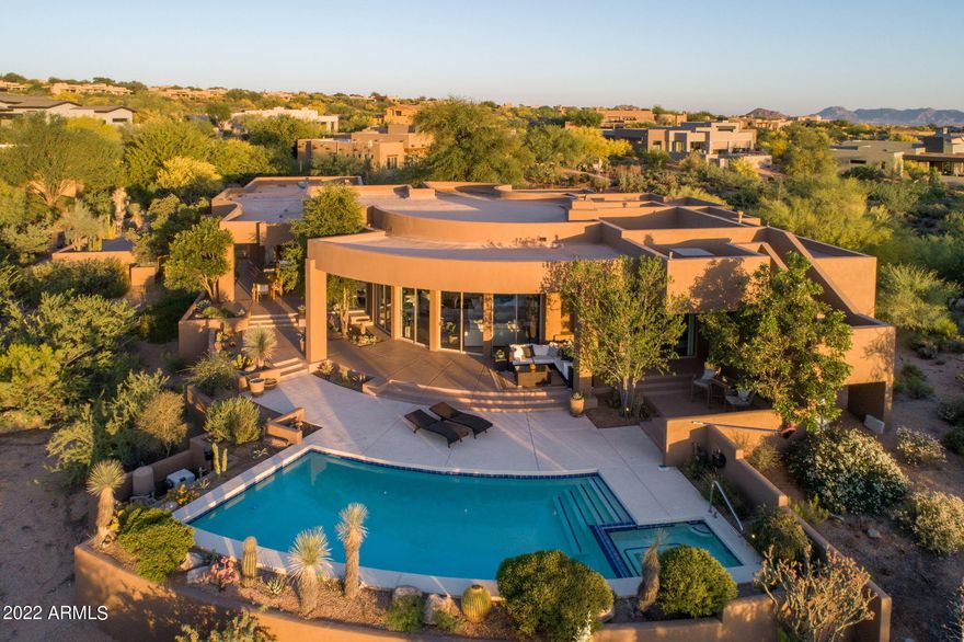 Fabulous contemporary remodel in the award winning Desert Mountain community. Located in Grey Fox Village, on a private preserve setting, overlooking  lush desert foliage and year-round sunsets. Stunning open great room plan, with floor to ceiling bank of windows to blend natural light and desert views with the interior spaces. Chef's kitchen beautifully reimagined.  Master retreat boasts modern fireplace and luxury bath.All new wood and porcelain tile floors throughout.  3 beautiful ensuite bedrooms and baths. 4th BR /casita has large sitting room and separate entrance. Wrap around resort patio features built in BBQ, pool and spa. Designer furniture is available on a separate bill of sale.