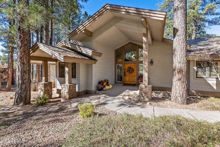 Celebrate summer in this move-in ready home walking distance to the Canyon Clubhouse.  Updated in 2025 with new air conditioning and furnaces, new interior paint throughout, and high quality carpeting in the lower level.  Enjoy a houseful of family and guests with 5 bedrooms and five bathrooms.  The main level features a primary suite, additional en-suite guest room, great room with floor to ceiling windows, a light-filled kitchen, dining room, and a laundry/craft room. There are three bedrooms and three bathrooms on the lower level.  Both floors feature huge, covered decks with endless views of the pines. Heart pine floors and paneled walls add to the elevated mountain home feel.  The over an acre lot offers privacy, yet convenience with walking access to all the Canyon Club has to offer.