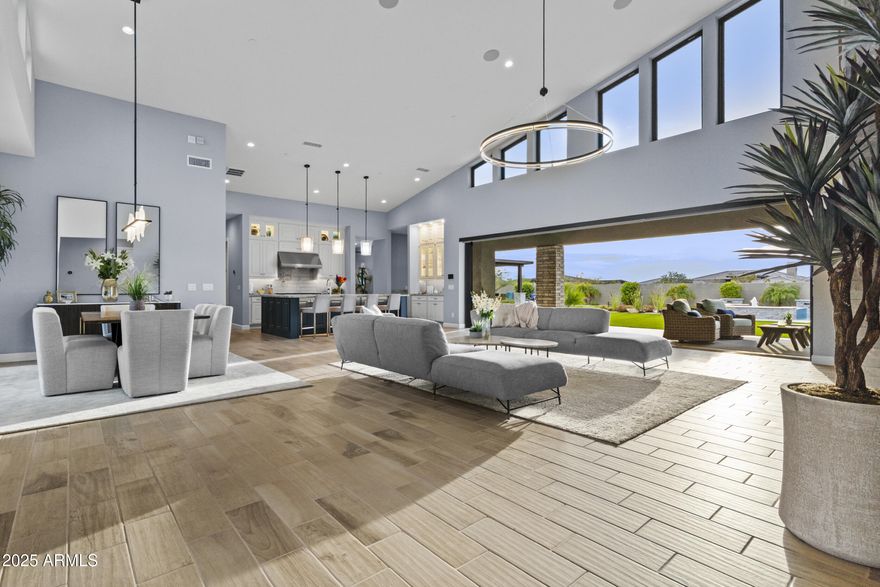 Stunning 2022-built mid-century modern home on a ¾-acre lot with sweeping views of The Boulders and Black Mountain. Designed for abundant natural light, this 3-bedroom, 3.5-bath residence features an expansive great room plus den, soaring ceilings, clean architectural lines, and an open floor plan. 3-car garage. A serene enclosed front courtyard showcases a dramatic water and fire feature. The resort-style backyard offers sunset views, a custom pool and spa, shaded gazebo, built-in BBQ, fire feature, citrus trees, artificial turf, and a meandering serenity garden designed for quiet reflection. Quiet neighborhood near golf, lakes, rivers, and the Tonto National Forest. Furniture is negotiable.