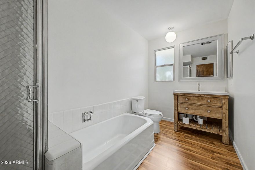 Welcome to this charming Co-Op, offering a warm blend of comfort and character. Wood-look laminate plank flooring, while a private balcony overlooking the pool provides the perfect spot to relax and unwind. The open floor plan is inviting and airy with unique retro paneling in the dining area. The kitchen is both functional and welcoming, featuring neutral tile flooring, a pantry, and ample wood cabinetry for storage. The spacious bedroom offers generous closet space, and the large bathroom adds to the home's overall comfort and convenience. Hassle-free living w/HOA fees that cover property taxes, water, trash, ext. maint, and grounds upkeep. The community amenities include a heated pool, clubhouse, and on-site laundry facilities. A wonderful opportunity to own a well-cared-for home.