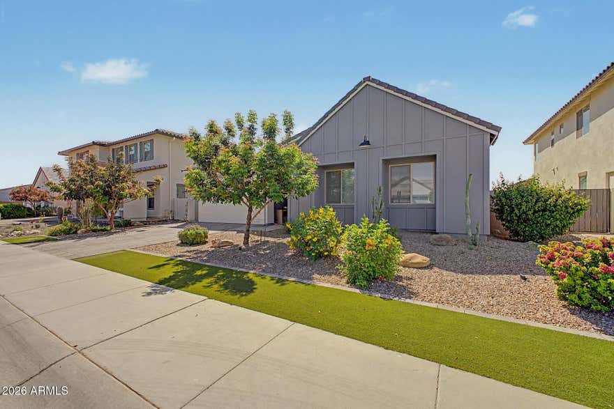 Stunning single level home located in the master-planned community of Waterston.  Enjoy resort style living in this community featuring lake, grand ramada, clubhouse with pool, and pocket parks connecting the entire community. Home features an open concept floor plan, 4 bedrooms plus flex room, 3 car garage, 3.5 bathrooms, and a  spacious den perfect for home office. The designer chef's kitchen offers large island with granite countertops, designer backsplash, touch faucet, staggered 42'' white cabinets, gourmet stainless steel appliances with 36'' gas cooktop, double ovens, refrigerator, reverse osmosis system and wine cooler. This kitchen is truly an entertainers dream. Split master bedroom offers frameless and upgraded walk-in shower and large walk in closet. Motorized blinds throughout Sliding glass doors. Refrigerator washer and dryer convey.