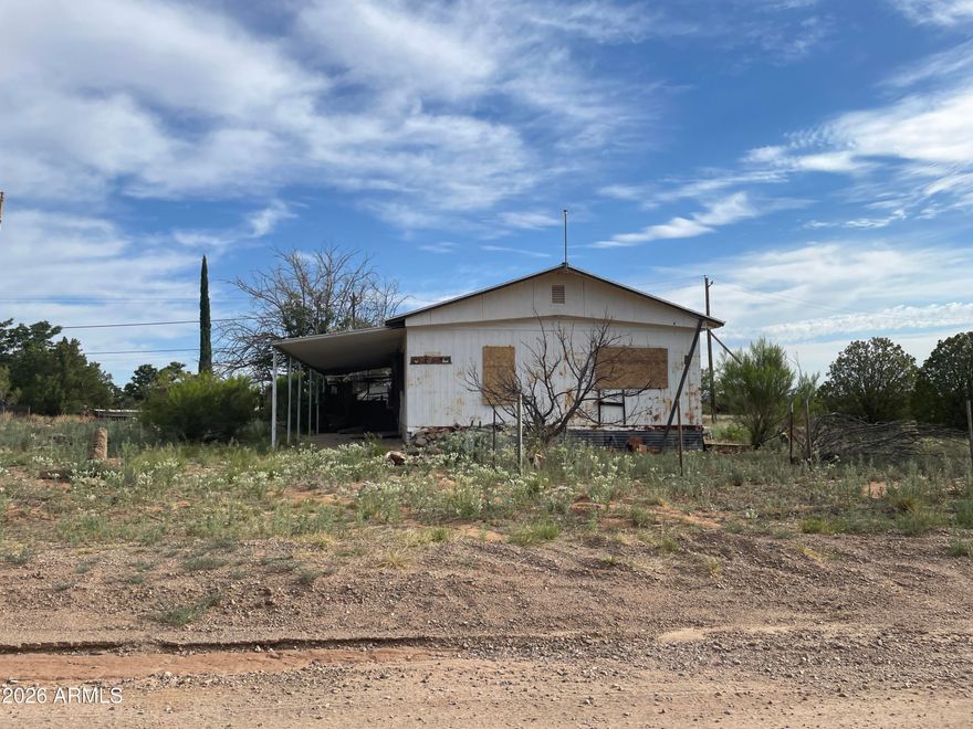 Corner lot with older mobile home. 17,395 sq ft in Miracle Valley Unit 2. Facts and figures are estimates, seller does not have any records regarding size or amenities. Needs work. Sold AS-IS. Seller will carry the loan.