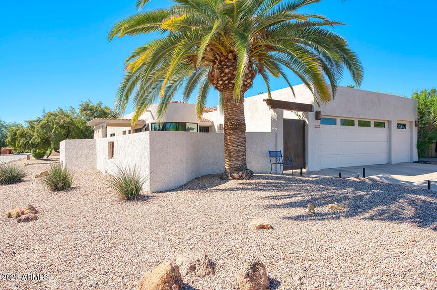 Mountain views in this unique corner lot with patios enclosed by block wall. Fully remodeled in 2023. This Open floorplan has new wood floors, wood ceiling accents and room to expand master bedroom. New carpet and walk in closets for both bedrooms. Kitchen has  new stainless appliances and quartz counters. New custom windows in expanded breakfast area. No steps, 2car + golf cart garage. Privacy and comfort.