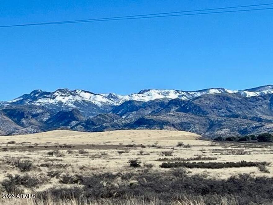 Spectacularly scenic 24AC, dividable and private parcel ADJOINING the Chiricahua National Monument along its eastern boundary and situated at 5200' elevation!  Water line is installed to SW corner of parcel. Recorded well agreement. Electric is approx 750' west of this parcel. Enjoy the 360 degree views of the Chiricahua's, Dos Cabezas, and Cochise Stronghold.  This area, AKA the ''Wonderland of Rocks'', offers so many recreational opportunities.  Build your dream home and enjoy this private retreat while having premier access to birding, hiking, horseback riding and camping.  Travel a short distance to local vineyards/wineries, Willcox (approx 30 min), Apple Annies, and so much more.  Soak in the sites and history of this unique area. When you walk this parcel, prepare to fall in love!