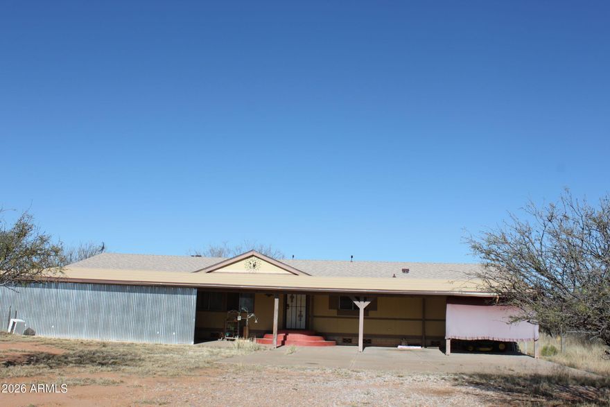 Here is an opportunity to own a desirable home in a great location.  4BR/2BA..Family room, formal living room, spacious dining area.  Utility/laundry leads to a fenced backyard.  Full length covered patio on west side of home.  Fenced and cross fenced.  Mature trees...ideal for horses, 4-H projects.
Views of Huachuca Mtns.  Mule Mtns. and San Jose.
New roof in recent years.