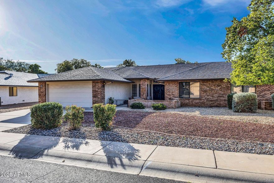 Discover the comfort and charm of this 2-bedroom, 1.75-bath Aspen model with 1,866 sq ft of thoughtfully designed space. The kitchen features Corian countertops and newer appliances, while a built-in office area is perfect for work or hobbies. Vaulted ceilings and abundant natural light create an open, inviting feel throughout. Enjoy peace of mind with a new roof and A/C installed in 2019. The serene greenbelt offers privacy and picturesque views. With low HOA fees, two parking spaces, and a great location on 143rd Dr., this home offers exceptional value and an easy, relaxed lifestyle.