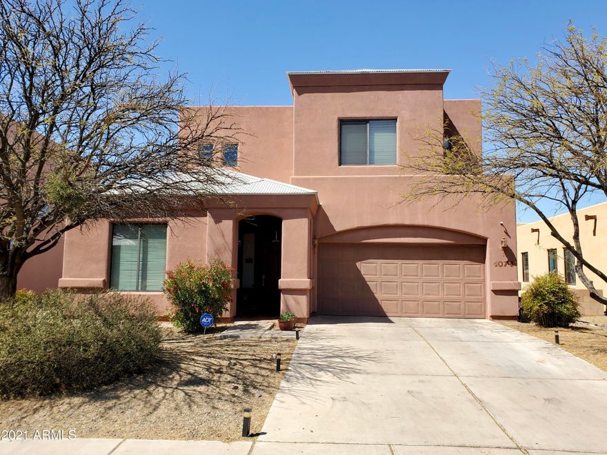 Outstanding property!!!  Do you need extra space??? It's here!  5 bedroom, 3 bathroom property with two living areas on a lot overlooking a wash.  No neighbors behind you!  Primary bedroom has a large balcony, view panels in fencing, all tile on first floor, desirable neighborhood that is near it all! (Refrigerator does not convey)