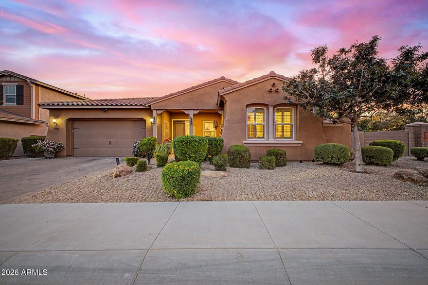 Stunning single-story home on a desirable corner lot! Fall in love with the exceptional curb appeal, easy-care landscaping, welcoming porch, & energy-saving solar panels. Delightful interior showcases tile flooring, neutral paint, recessed lighting, plantation shutters, surround sound speakers, & an open den for an office or flex space. Elegant formal living & dining rooms provide the ideal setting for entertaining, while the spacious family room features a media niche. The beautifully designed eat-in kitchen has a huge center island for prep & breakfast bar, granite counters, SS appliances, subway tile backsplash, white cabinetry, walk-in pantry, & butler's service area. Retreat to the luxurious main suite boasting private backyard access & spa-inspired bathroom. Dual vanities, soaking tub, glass-enclosed shower, & generous walk-in closet! A Jack & Jill bathroom, a bonus room, & functional mudroom add flexibility. Discover a laundry room showcasing built-in cabinets & a utility sink! The impressive exterior continues with a 3-car tandem garage, paver driveway, & a resort-style backyard. Relax beneath the covered patio w/retractable shades, take a dip in the sparkling pool & spa combo, entertain under the ramada w/built-in BBQ, rinse off in the outdoor shower, & enjoy the beauty of artificial turf. See it, love it, live it!