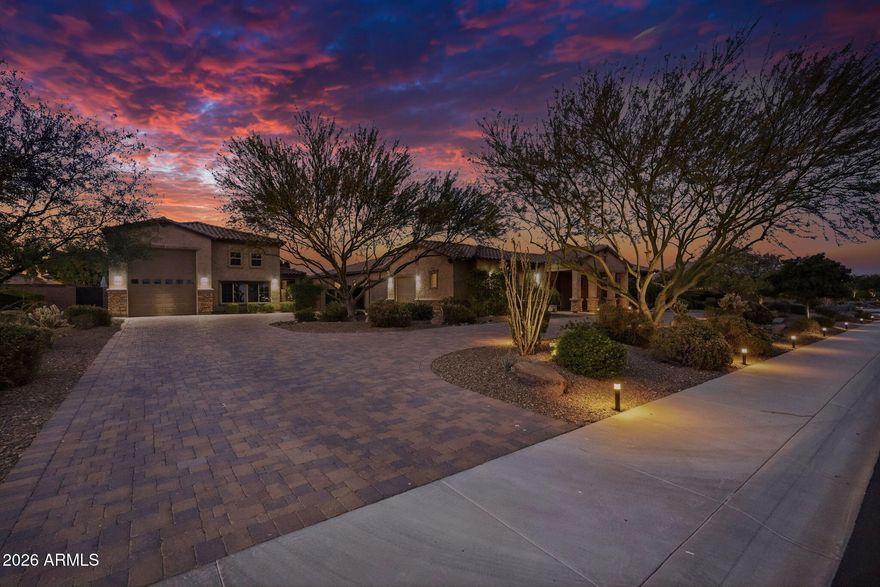 Experience refined desert luxury in this exceptional custom estate located within the exclusive gated community of Vista Montana. Privately positioned on an expansive corner homesite, this residence blends sophisticated design with effortless indoor-outdoor living. A grand courtyard entry welcomes you into a home appointed with top-tier finishes, designer details, and thoughtfully curated living spaces throughout. The resort-inspired grounds feature premium artificial turf for a lush, low-maintenance landscape year-round, along with a private sport court ideal for recreation and entertaining. An oversized RV garage and two detached guest casitas provide unmatched versatility for multi-generational living, executive office space, or private guest accommodations Just minutes from the best shopping, dining, and the outdoor recreation of Lake Pleasant Regional Park, this is elevated Arizona living at its finest.