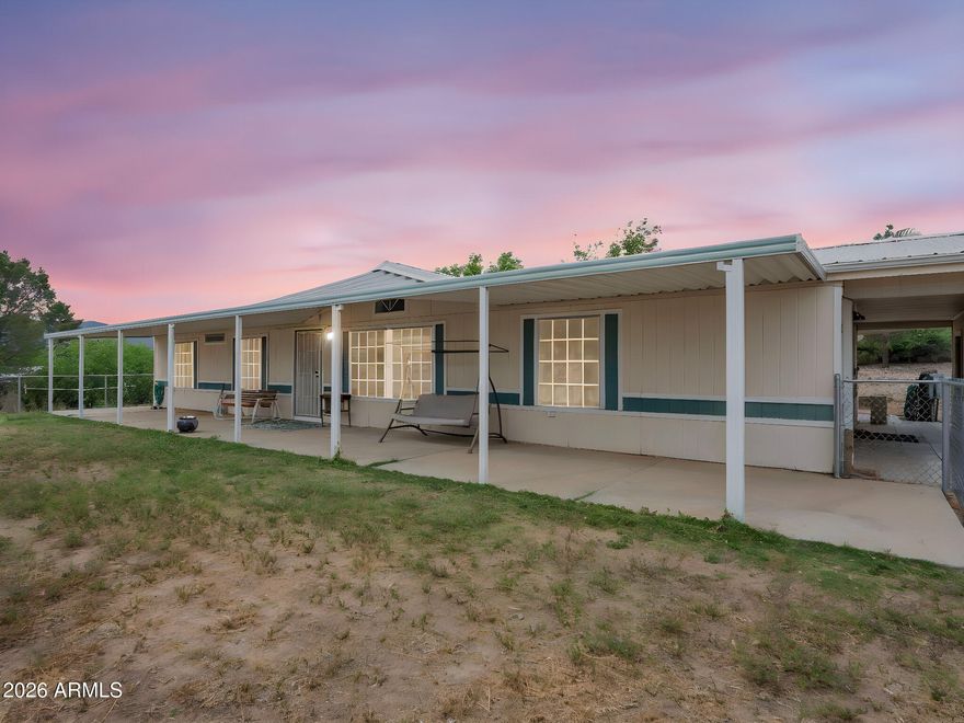 Come Home to 1602 N Montezuma Heights Rd.  This is Country Living That is Close to Sedona, & Just Five Minutes From Shopping, Restaurants, Casino and Freeway. AND NO HOA!!  This Home Features 1792 Sq. Ft., 3 Bedrooms, 2 Baths, with Fireplace in Family Room.  Split Floor Plan, Huge, Huge Porches, Front and Back. Save on Utilities with Palm Harbor 2 x 6 Construction!!!  Additional Az Room with heating & AC.  Also  Detached Two Car Garage, All With Seamed Metal Roof. And there are Storage Rooms and Sheds. Do You Happen to Have an RV? Well it Will Have a Home Too!  Huge Covered RV Carport. All This on 1.22 Fenced Acres, Your Own Well and Newer AC. & Horse Privileges. You Can Ride Your Horse Across the Street to Rope. No Need to Trailer. Come & Make This Home  Your Own! AND NO HOA!!!