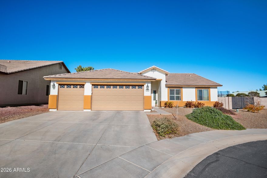 Beautiful 4 bedroom 2 bath home located in the highly desirable Holiday subdivision. This home features an open concept floor plan, offering both functionality and privacy.  the spacious primary suite includes a large bedroom and private en-suite bath. Enjoy Arizona living in the beautifully designed backyard, perfect for relaxing or entertaining year-round. Situated on a cul-de-sac lot for added privacy and a generous yard. Conveniently  located near the community clubhouse with pools, parks, fitness room, and more. A blend of comfort, location, and lifestyle.