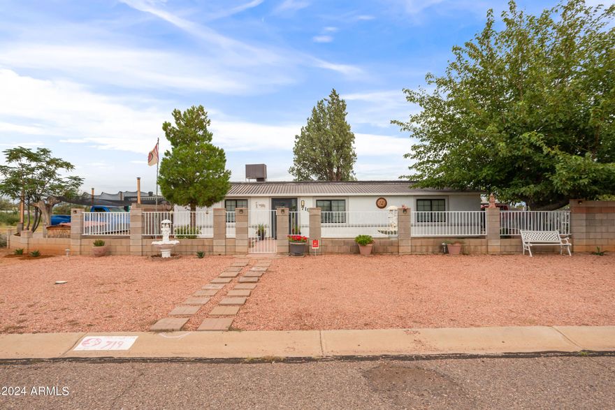 This 1,344 square foot, 3-bedroom, 2-bathroom home is nestled on a desirable corner lot and offers a comfortable living experience. Inside, you'll find a bonus room that could serve as a home office or extra living space. The kitchen is equipped with a gas range, ample storage, and a convenient pantry.
The outdoor area is a true highlight, featuring beautiful mature shade trees and a charming water fountain, creating a peaceful retreat. There's also a large gazebo, perfect for gatherings, along with plenty of storage options. The property includes RV parking and is secured by a wood and brick fence, offering both privacy and space.
If you're looking for a cozy corner lot home with great outdoor space, this could be the perfect fit.