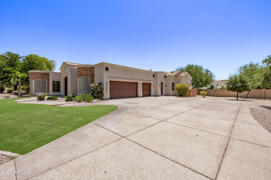 Nestled in a prestigious gated cul-de-sac community in the heart of Scottsdale, this stunning custom home sits on over an acre of land and delivers the perfect balance of luxury, comfort, and functionality — an entertainer's dream come true. Featuring 4 bedrooms and 4.5 bathrooms, each bedroom includes its own en-suite and spacious closet. The expansive primary suite is a private retreat with a custom marble fireplace, a spa-like marble shower, and a massive walk-in closet. The chef's kitchen is outfitted with a brand-new Thermador appliance package, dual sinks including a prep sink, and generous counter space. A large laundry room with an extra fridge and ample storage adds practical luxury. Beautiful custom-engineered hardwood floors run throughout the home, elevating the interior with warmth and sophistication. The inviting family room showcases a striking custom cast stone fireplace, while the separate formal dining room and spacious great room with surround sound provide ideal settings for entertaining. Step outside to a resort-style backyard complete with a pool and hot tub, all-new pool equipment, a built-in BBQ, and a generous covered patio perfect for indoor-outdoor living. The expansive lot includes undeveloped space ready for a guest house, sport court, or personalized outdoor expansion. A convenient RV gate adds extra utility. Additional upgrades include three new AC units, full pool and spa Pebble Tec resurface, all new pool equipment and heater, motorized roller shades for energy efficiency and privacy on every window and door, epoxied garage floors, and brand-new garage doors and openers. This exquisite home combines custom craftsmanship, modern amenities, and unmatched outdoor potential all within a unique, private gated community of only four homes!