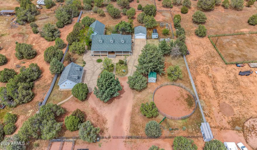 Private Horse Ranch Retreat in the Heart of Payson, Arizona. 

Tucked away on 2.71 acres of pristine land, your new horse property is more than just a home -- it's a lifestyle. 

Your secluded slice of heaven is fully fenced, cross-fenced, and thoughtfully set up for both horses and cows. 

Whether you're a full-time rancher, hobby farmer, or outdoor lover looking for space to roam, this place has you covered.

Set up new ranch home features a beautiful covered porch, four bedrooms, and 2.75 bathrooms, including a private guest suite setup perfect for multi-generational living, visitors, or a rental opportunity -- all under one roof. And not just any roof: your 50-year metal roof is designed to look like beautiful tile shingles, offering both durability and curb appeal.
 
Your high quality, custom FCP barn is the envy of many! It is beautifully crafted and designed to make ranch life easy and accessible. You can pull a trailer of hay right inside and feed right off it. No more moving heavy bales over to the barn from hay storage. 
There's plenty of room to park a truck and trailer inside too! 

Either way, it's ready for your animals to move right in. And when you're done riding, enjoy time under the shade of all the beautiful trees on your property or gather fresh eggs from your chicken coop, or simply soak up the peaceful mountain air.

Additional equestrian features include a classic shed row barn with individual run-outs, a round pen, and multiple sheds for feed, tools, and tack.

You'll also find a 3-car garage and a 2-car garage  perfect for storing your truck, trailer, toys, or farm equipment. Bonus? There's an indoor dog kennel setup for puppies, sick dogs, or those that just need a cozy outdoor haven.

This property offers true privacy, with few neighbors in sight  just you, the elk, deer, and abundant wildlife that wander through. 

Whether you're working the land or simply enjoying the quiet, it's a dream come true for anyone craving a rural escape with all the right amenities.

Welcome home to Payson  where nature, freedom, and country living meet.

Easy to see with a few hours advanced notice.