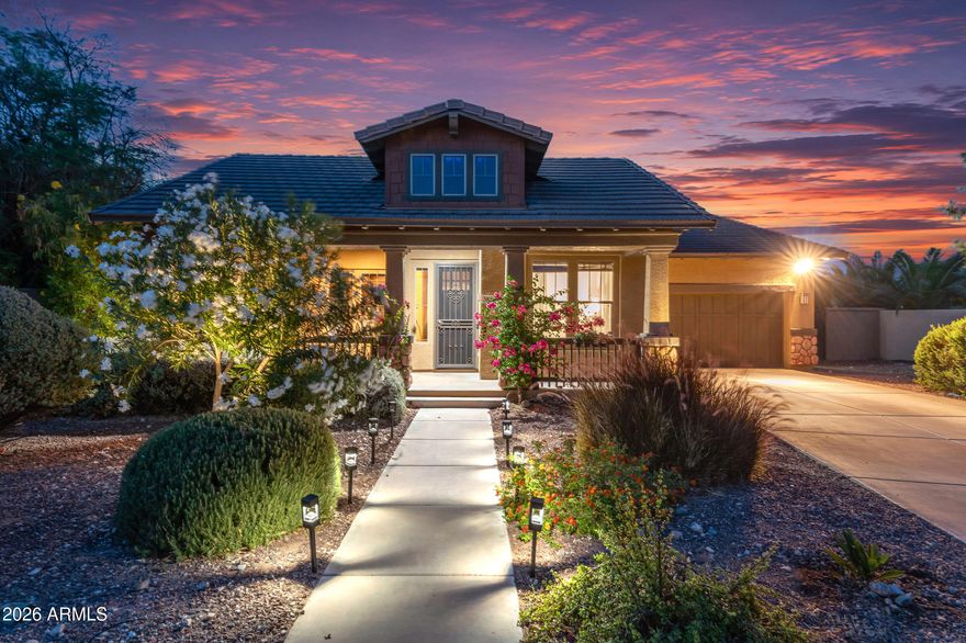 Located on a rare 1/2-acre lot in Verrado's highly sought-after Main Street District, this sprawling and immaculate professionally designed private oasis invites you to unwind and stay awhile. With generous spaces inside and out, it's perfect for quiet relaxation or hosting everyone you love poolside.

The main residence features 4 bedrooms, 3 bathrooms, and 2,693 sq ft of beautifully appointed living space. A 3-car tandem garage includes a soft water system, plus an RV gate for additional parking and storage.

An incredible 676 sq ft guest casita offers the ideal retreat for visitors or a private home office, complete with 1 bedroom, 1 bathroom, a kitchenette, and a spacious great room. Step outside to an estate-style backyard--an ultra-private sanctuary designed for year-round enjoyment and effortless entertaining. Verrado is known for beautiful homes, shady tree-lined streets, inviting front porches, and a strong sense of community for residents of all ages. With so much to do around Verrado, there are endless opportunities for neighbors to become fast friends. Resort-style pools and spas, scenic trails, beautiful parks, a fitness center, championship golf, and endless community activities all create an unmatched lifestyle.

So what exactly makes life in Verrado so special? It's a collection of wonderful little things that come together to create something extraordinary. Verrado's walkable Main Street District places shops, dining, and community events just minutes from
