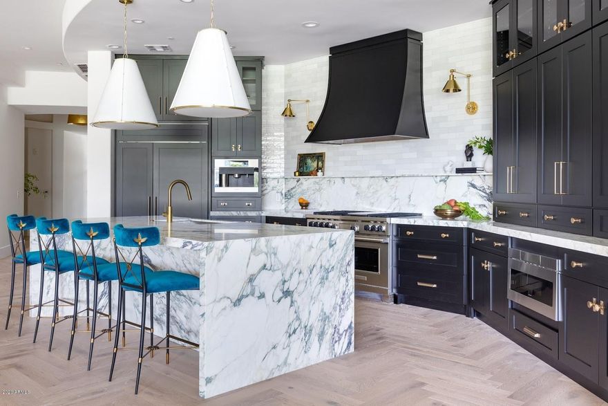 Award winning London Pierce's extraordinary French Modern renovation on the 10th hole of the Biltmore Adobe Golf Course is something to behold. The location alone is a lure, w the iconic Waldorf Astoria Biltmore Hotel just outside the gated entrance. Wow your clients with the timeless, classic, and extraordinary design features of this highly sought after rare 4817 sq ft ground floor walk out residence with wrap around patios and views.  It's the perfect safe, secure, private sanctuary or retreat, full or part time, to enjoy Phoenix and the surrounding attractions. Shown by appointment only. Masks required. See Virtual Tour!!!!