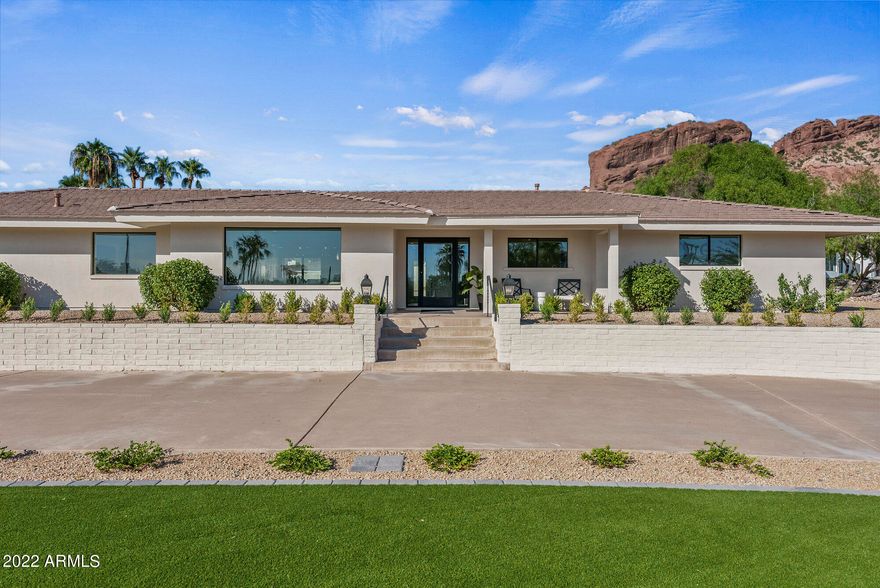 Exceptional transformation at the head of the Iconic Camelback Mountain! Luxurious & Lavish in TOP Location! This gorgeous home has been taken down to the studs! Top quality craftsmanship went into this recreation to capture the BEST 3,477 square feet of LIVING possible! Featuring open bright floor plan, exquisite chefs' kitchen, four bedrooms, three bathrooms, with designer touches throughout every square inch! Spectacular entertainers' outdoor paradise captivating views to immerse in the beauty of Arizona Living!