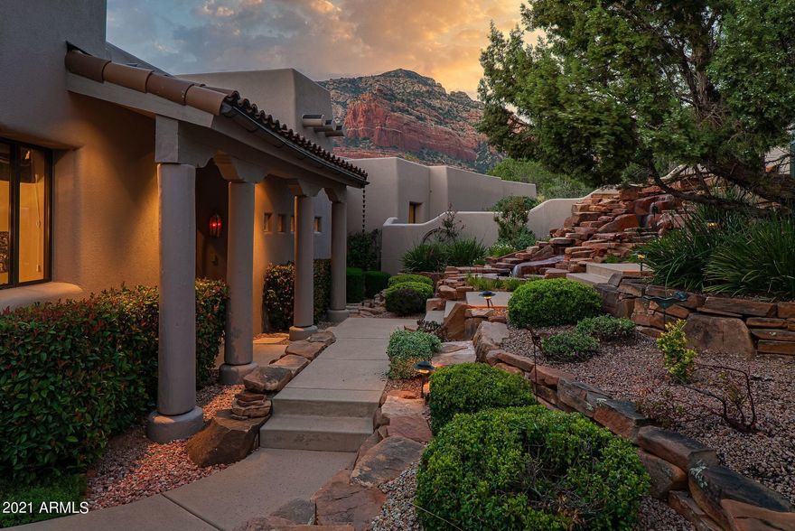Extraordinary quality home in the premier gated community of North Slopes in West Sedona captures expansive red rock views and peaceful serenity! This pristine custom Southwest Contemporary home borders National Forest and sits on two-acres! Featuring a 50' first-class RV garage (or car collector dream garage); great room with built-in bar; kitchen with gourmet island and breakfast nook; dining room; den/media room; office with gorgeous built-in executive furniture, three gas indoor fireplaces; and hot tub. Split master suite and two luxurious guest bedroom en-suites with private baths & decks. Front patio offers spectacular resort-style ambiance with a mood enhancing red rock waterfall and outdoor fireplace. Incredible outdoor wrap-around red rock view deck. New roof with warranty. Rooms Include: 
1. Great Room With Walls Of Glass Showcasing The Red Rocks. 
2. Sunken Wet Bar With Small Refrigerator & Built-In's
3. Kitchen With Breakfast Dining. Appliances include 2 dishwashers, 3 disposals, 3 refrigerators (1 large & 2 small), chest freezer, warming drawer, 2 ovens (convection & gas oven)
4. Dining Room With Double-Sided Rock Fireplace
5. Executive Office With Built-In's - Could Be 4th Bedroom
6. Media Room/Den With Built-In Sound System 
7. Master Bedroom/Bathroom With With Premium Walk-In Closet, Dual Vanities, An Additional Beauty Vanity, Large Soaking Tub, Walk-In Shower
8. Two Guest Bedroom En-Suites With Private Bathrooms and Walk-In Showers. Both Guest Bedroom Suites Include Private Decks. The Other Guest Suite Has An Office Space. 
9. Laundry Room
10. Half Bath (Powder Room)


Additional Amenities:
1. 50' RV Garage + Bonus Storage (Holds a 45' RV) + RV Dump + 50 AMP + Hot & Cold Water Valves. RV Garage Can Hold Up To 6 Vehicles
2. Two (2) Car Oversized Garage + Additional Bay For Vehicle & Workshop Area
3. Heated Hot Tub
5. Newer Warrantied Rolled Roof (PVC Material) By Hales Roofing
4. Gas Water Heaters
5. Premium Stone (Flagstone) Floors
6. Vega Beams - All Exterior Beams Capped To Protect From Rain & Sun Damage
7. Aerobic Septic System Serviced Annually By AZ Wastewater
8. Outdoor Built-In Barbeque and Small Refrigerator
9. Three (3) Indoor Gas Fireplaces & (1) Outdoor Fireplace 
10. Red Rock Waterfall In Front Courtyard
11. Wrap Around Deck With Incredible Views
12. Two (2) Finished Storage Rooms Below Deck
13. 2-Acre Parcel