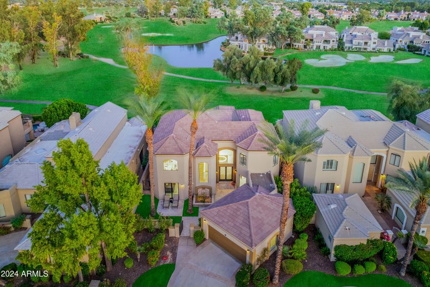 RARE TOTALLY REMODELED HOME in Enclave #2, with unparalleled  views of the Lakes #5 golf course, overlooking water, mountains, and with additional expansive views of the golf course on holes 2, 3 and 4. No expense was spared in this totally remodeled modern chef's kitchen with Waterfall Quartzite countertops, WOLF gas stove and center wok burner (propane), TWO Subzero Fridges with freezer drawers, and cabinetry from Plain and Fancy. This great entertaining 4 bedroom 3.5 bath home offers a quality paneled Library/bedroom on the main level with full bath, a great room with wet bar, and private media room. New windows and slider doors. Lutron electric window blinds throughout. The main rooms open to a fabulous backyard with pool and waterfalls, firepit, with spectacular golf course views. Enjoy all the amenities Gainey ranch has to offer. New ''state of the art'' Gainey Ranch Estate club with everything from tennis and pickle ball to a spacious work out facility. Close to shopping at the Gainey Village and walking to the Hyatt Hotel!