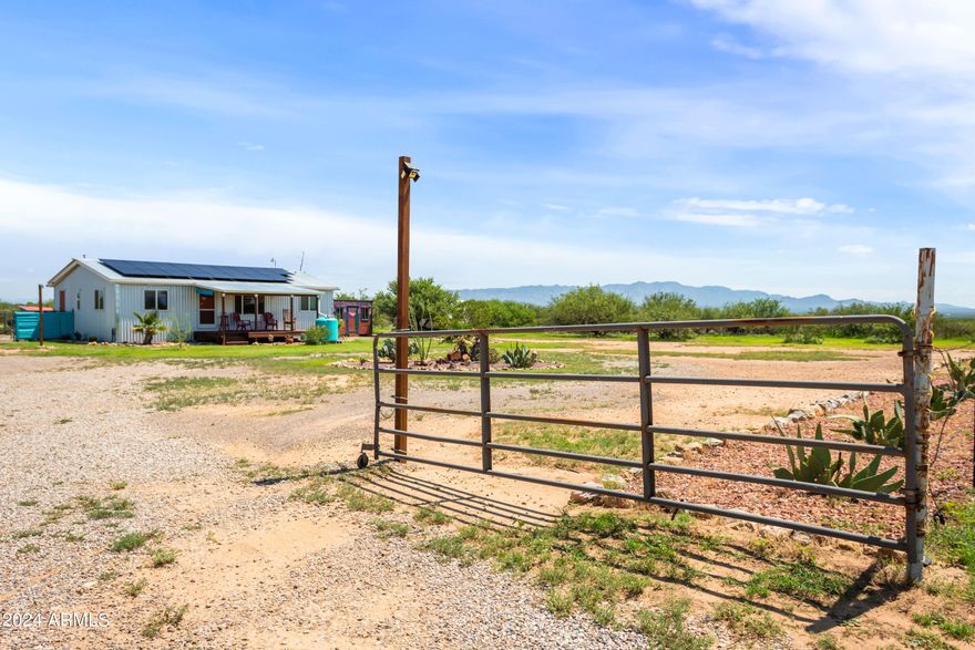 Welcome home to this beautiful 3-bedroom 2-bathroom house. Sitting on an amazing 20 acres you will be able to live with all the privacy and space needed for all your heart's desire. Stepping inside you will have a great open concept between the kitchen, dining area and living room as well as a split floor plan this home provides. This property is equipped with fencing for the full lot as well as a separate immediate backyard area. In the backyard you will find a spacious shed for your storage needs. The home has been thoughtfully updated and maintained to include metal siding and roof, solar panels (leased), new paint on the interior and exterior and so much more proving the pride of ownership and love. Short distance down a dirt road drive yourself to your new home!