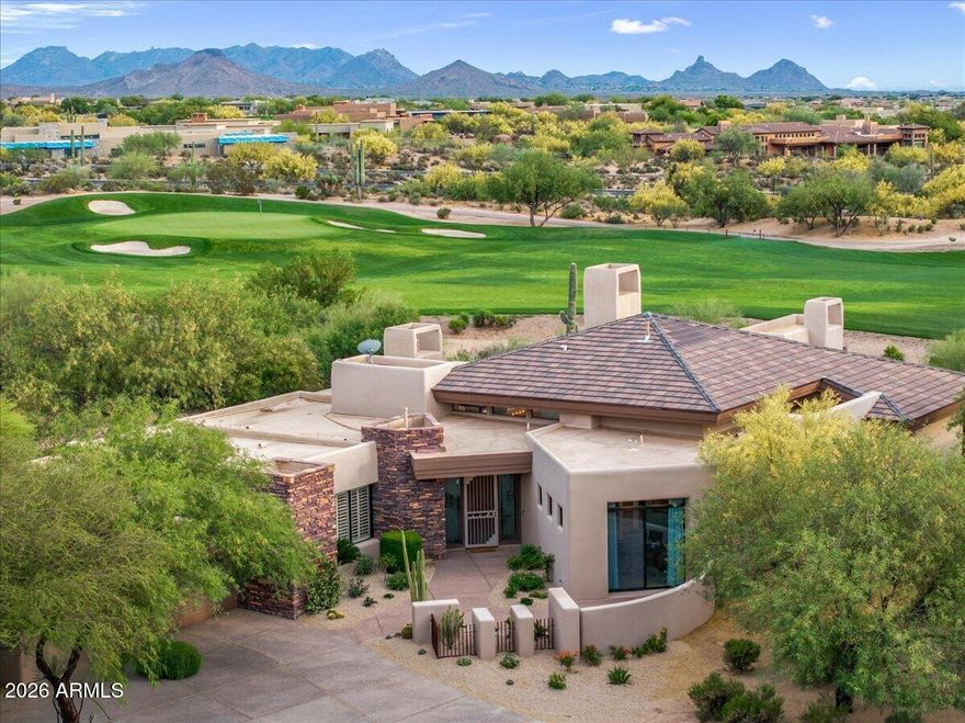 This Bing Hu designed home is the epitome of luxury and craftsmanship in the highly sought after community of Desert Mountain. The entire home has been totally reimagined and recreated using the finest materials and finishes, expertly crafted by Tarver Construction. Every detail has been thoughtfully customized to evoke a sense of warmth and style. The open floor plan kitchen and great room invite gatherings with friends and family. The Primary Suite offers privacy and tranquility while being enveloped in lavish ambiance. Three well-appointed guest suites will not disappoint. The outdoor living spaces offer spectacular golf course, mountain and sunset views complementing the expansive private patio with a heated pool & spa, gas fire pit and outdoor gas grill. A membership is not included.