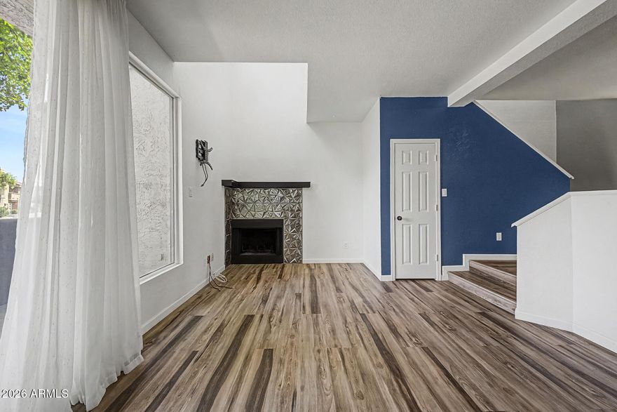 Discover this charming two-story townhome in Milano Terrace! Explore the inviting interior, showcasing wood-look floors, abundant natural light pouring in, a fireplace to add warmth, and an earthy-cool palette that creates a comfortable ambiance throughout. The galley kitchen boasts ample cabinetry, spacious counters, built-in appliances, a pantry, and also hosts the laundry area for added convenience. Two primary suites for extra comfort, both featuring walk-in closets for effortless organization. Out back, you'll have a nicely sized patio perfect for relaxation. This welcoming community has so much to offer, including pools, spas, walking trails, a fitness center, BBQs, and more! You don't want to miss it!