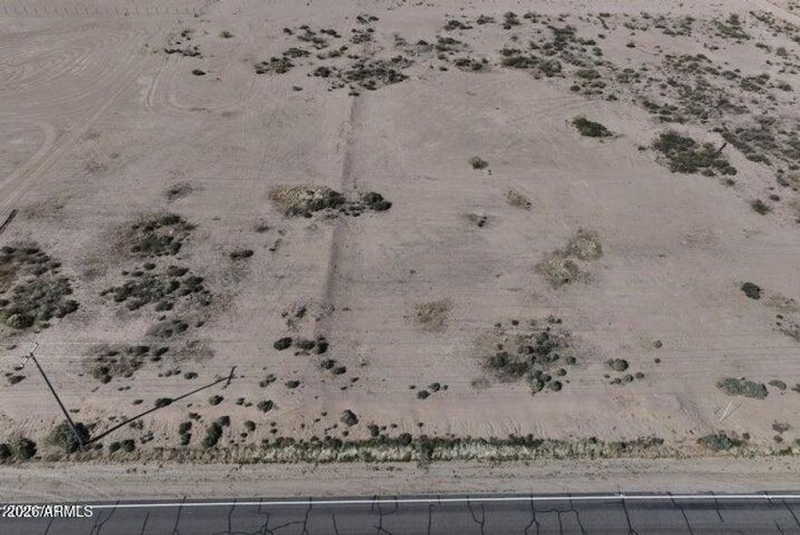 1.61 Acres of prime Arizona desert land - Endless potential with stunning mountain views. Discover the opportunity to own 1.61 acres of pristine Arizona desert. The expansive vacant lot features: Easy access via a well-maintained cement road, natural desert landscape with native vegetation, and breathtaking panoramic mountain views. Survey markers already in place, making it ready for your vision. Ideal location with convenient proximity to main roads while still offering the peace and privacy of wide-open space. Whether you're seeking an investment, or a slice of desert paradise, this land is a rare find.